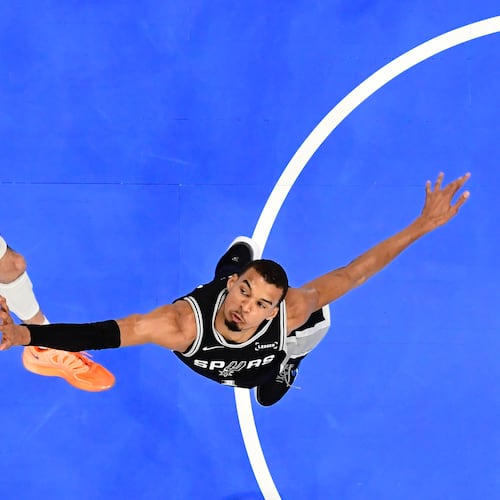 San Antonio Spurs forward Victor Wembanyama, right, blocks a shot by Oklahoma City Thunder center Chet Holmgren during the first half in Game 5 in the Western Conference finals NBA basketball playoffs series, Tuesday, May 26, 2026, in Oklahoma City. (AP Photo/Gerald Leong)
