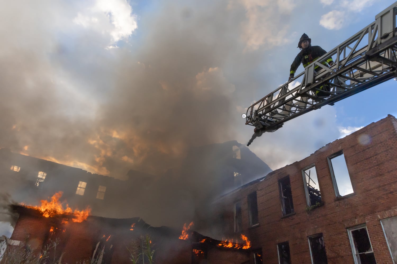 Atlanta firefighters went to it Thursday morning, June 13, 2024 battling a blaze at Morris Brown College for the second time in the past 16 months at the historic building formerly known as Gaines Hall. Crews arrived just before 8 a.m. just off Northside Drive at Martin Luther King Jr. Drive, according to Atlanta Fire Rescue. (John Spink/AJC)