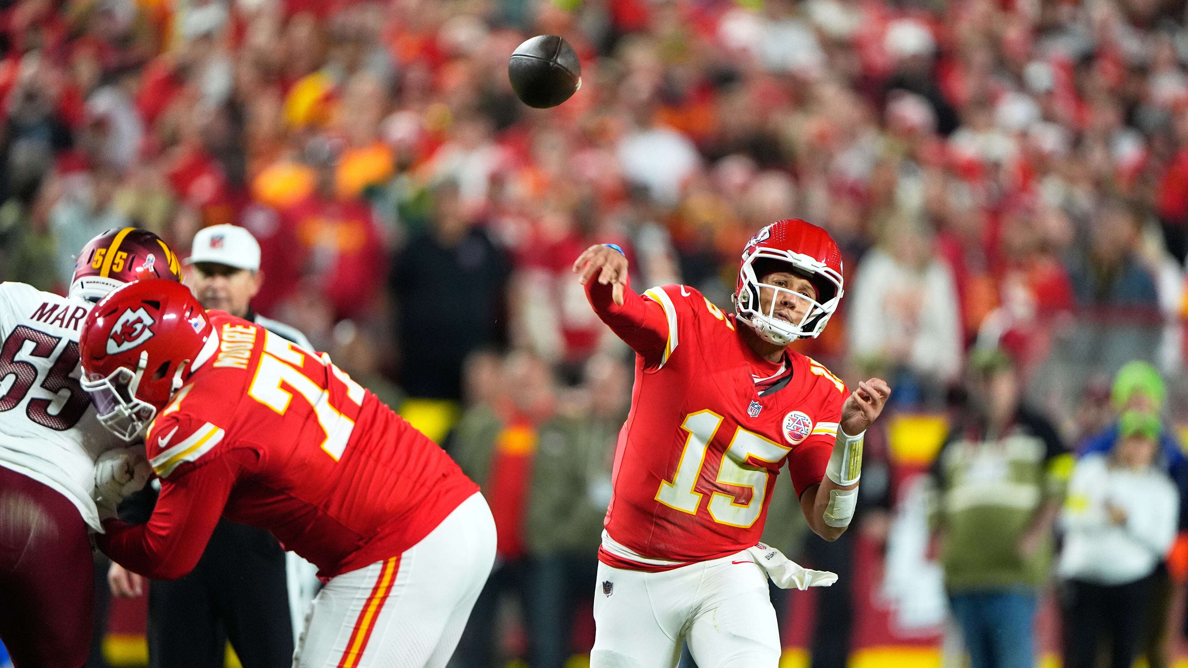 Kansas City Chiefs quarterback Patrick Mahomes (15) throws during the first half of an NFL football game against the Washington Commanders Monday, Oct. 27, 2025, in Kansas City, Mo. (AP Photo/Charlie Riedel)