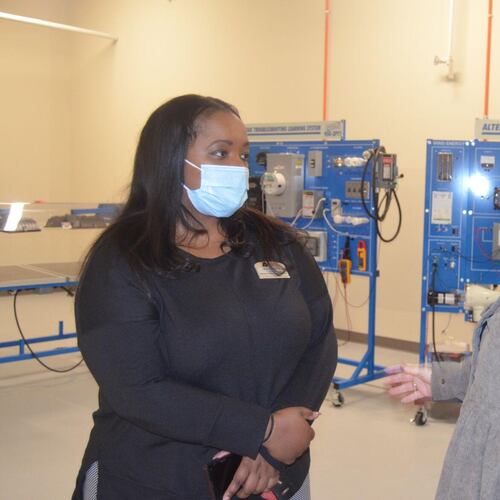 Lisa Stephens, dean of business/health care/technology at Albany Technical College, left, has a conversation with Lisa Harrell, dean of academic affairs, on Tuesday.