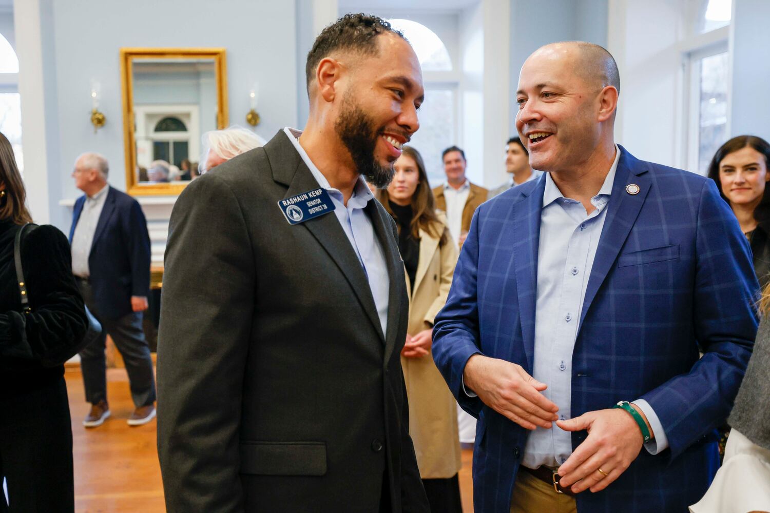 Georgia Attorney General Chris Carr (right) confers with state Sen. RaShaun Kemp, D-Atlanta, at the Wild Hog supper, the traditional kickoff to the legislative session in Atlanta, on Sunday, Jan. 11, 2026.  (Miguel Martinez/AJC)