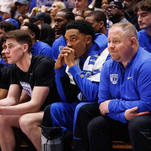 Duke's Caleb Foster sits on the bench wearing a boot after suffering an injury during the first half of an NCAA college basketball game against North Carolina in Durham, N.C., Saturday, March 7, 2026. (AP Photo/Ben McKeown)