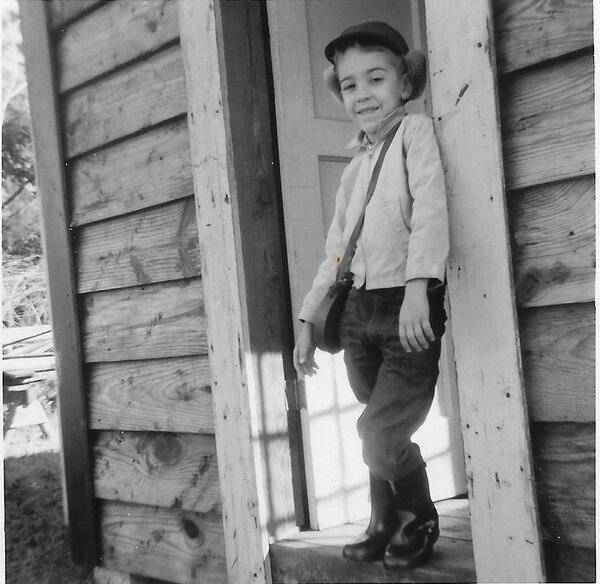 Writer Bill King, seen in the doorway of his childhood clubhouse in the backyard of his family’s home on Hope Avenue in Athens, was the organizer of the street’s Fourth of July parades in the 1960s. CONTRIBUTED BY THE KING FAMILY