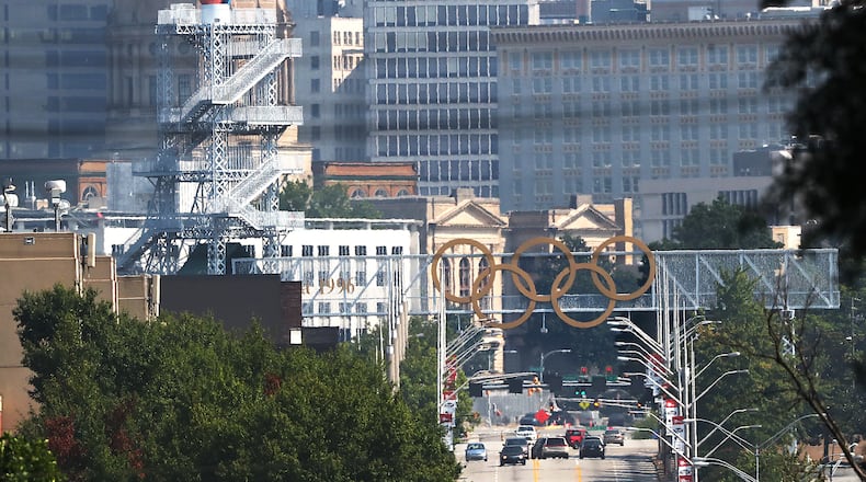 The Olympic cauldron and rings are seen against the Atlanta skyline on Monday, August 2, 2021, in Atlanta.  Curtis Compton / Curtis.Compton@ajc.com