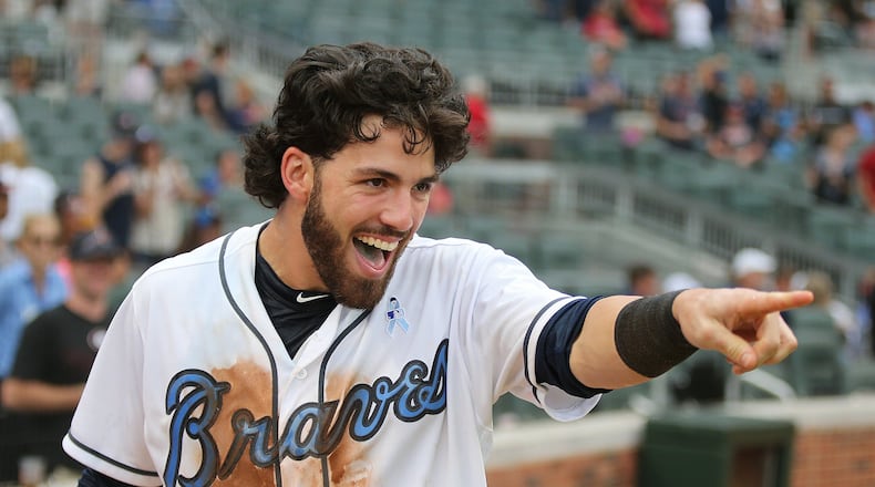 Dansby Swanson laughs at Brandon Phillips after he dunked him for hitting a walk off RBI single to beat the Miami Marlins 5-4 during the ninth inning in a MLB baseball game on Sunday, June 18, 2017, in Atlanta. Curtis Compton/ccompton@ajc.com