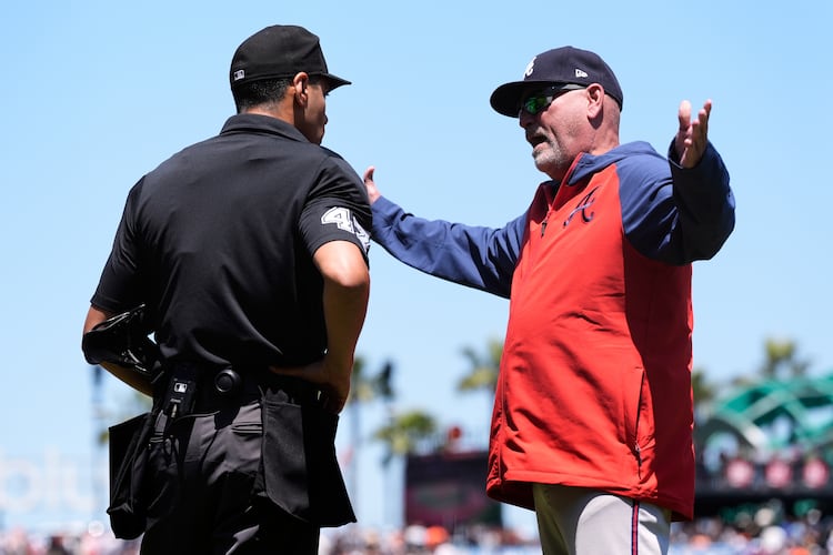 Atlanta Braves manager Brian Snitker, right, speaks with home plate umpire Gabe Morales after being during ejected in the fifth inning of a baseball game against the San Francisco Giants, Saturday, June 7, 2025, in San Francisco. (AP Photo/Godofredo A. Vásquez)