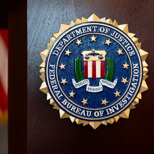 FILE - An FBI seal is displayed on a podium before a news conference at the field office in Portland, Ore., Jan. 16, 2025. (AP Photo/Jenny Kane, File)