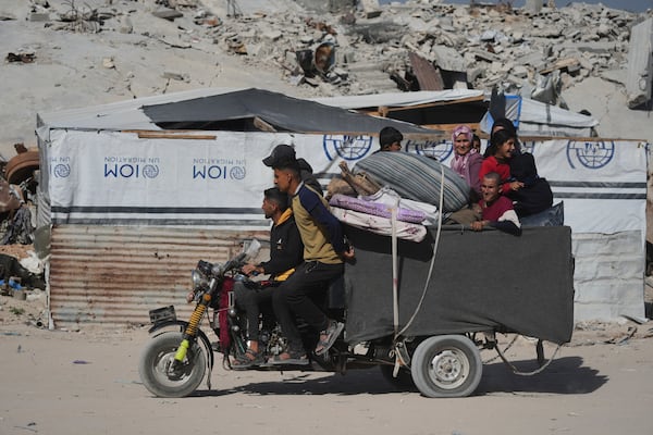Displaced Palestinians fleeing Beit Lahia amid ongoing Israeli military operations in the Gaza Strip arrive in Jabalia, northern Gaza, on Friday, May 16, 2025. (AP Photo/Jehad Alshrafi)