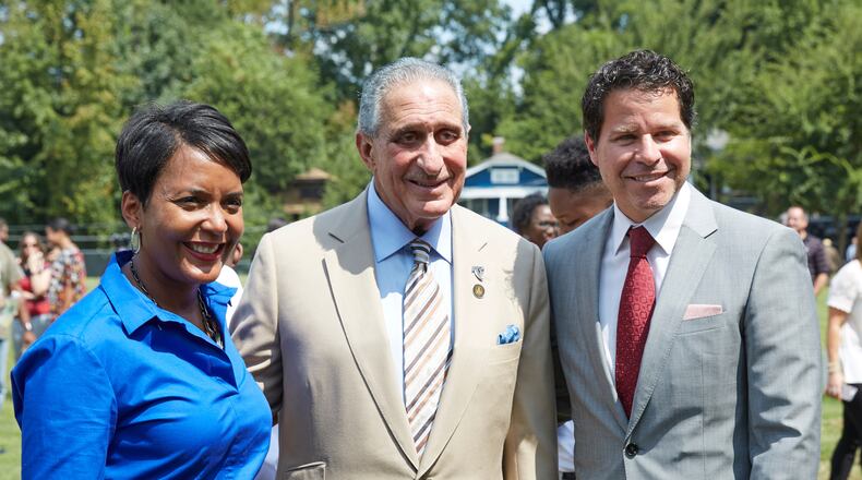 Atlanta Mayor Keisha Lance Bottoms, Falcons owner Arthur Blank and Atlanta Sports Council president Dan Corso participated in a groundbreaking ceremony for a park renovation Wednesday. (Contributed photo by Paul Abell)