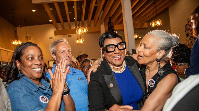 Former Commissioner Lorraine Cochran-Johnson (second from right) will be the next chief executive officer of DeKalb County.