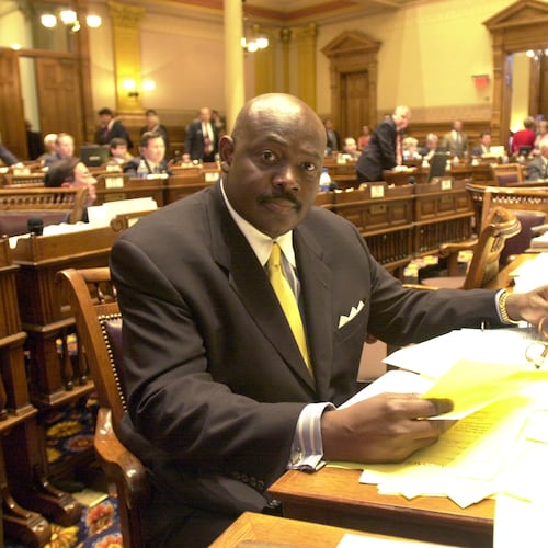 Charles Walker Sr., seen here as he sits at his desk in the state Senate in 2002. (W. A. Bridges Jr./AJC)