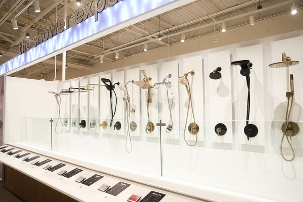 At the new Wayfair store in Atlanta, shoppers can test how water flows through various showerheads. (Abbey Cutrer/AJC)