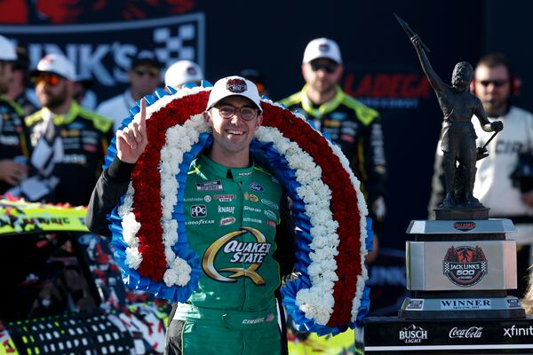 NASCAR Cup Series driver Austin Cindric celebrates after winning a NASCAR Cup Series auto race at Talladega Superspeedway, Sunday, April 27, 2025, in Talladega, Ala. (AP Photo/Butch Dill)
