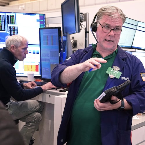 Options trader Brian Garvey, center, works on the floor of the New York Stock Exchange, Monday, May 11, 2026. (AP Photo/Richard Drew)