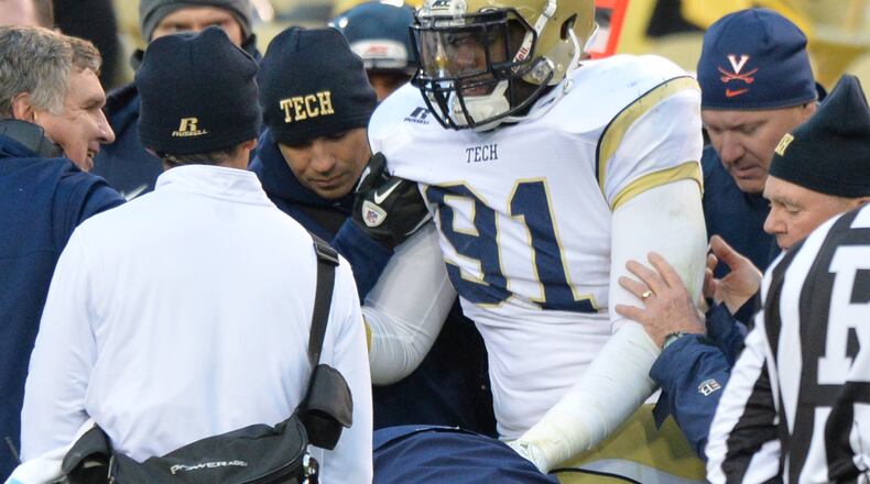 Georgia Tech Yellow Jackets defensive lineman Patrick Gamble (91) is escorted out after he injured in the second half at Bobby Dodd Stadium on Saturday, November 1, 2014. Georgia Tech Yellow Jackets won 35-10 over the Virginia Cavaliers. HYOSUB SHIN / HSHIN@AJC.COM