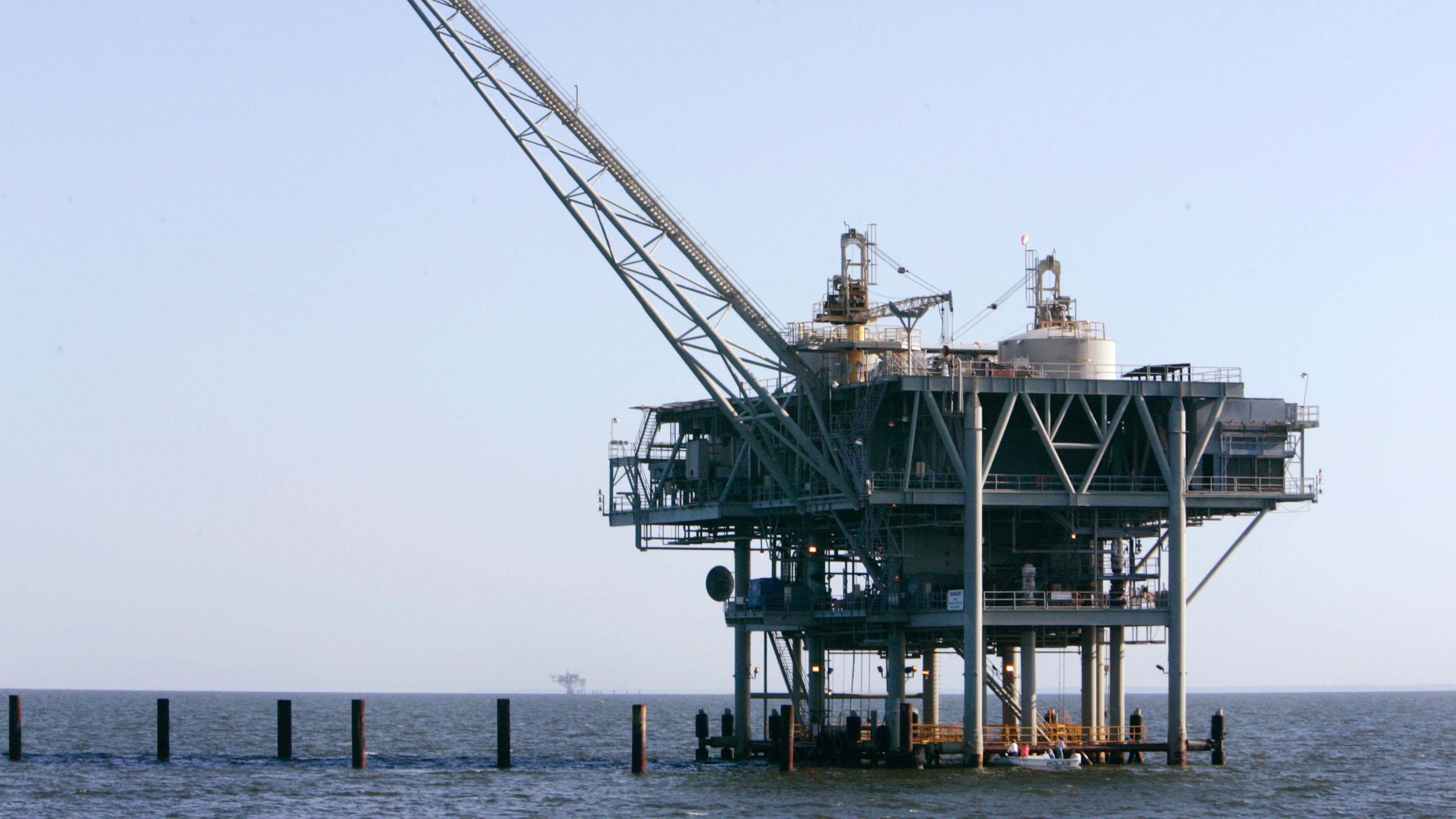 FILE - A natural gas platform is shown, April 13, 2006, off the coast of Fort Morgan, Ala. (AP Photo/Rob Carr, File)
