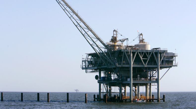 FILE - A natural gas platform is shown, April 13, 2006, off the coast of Fort Morgan, Ala. (AP Photo/Rob Carr, File)