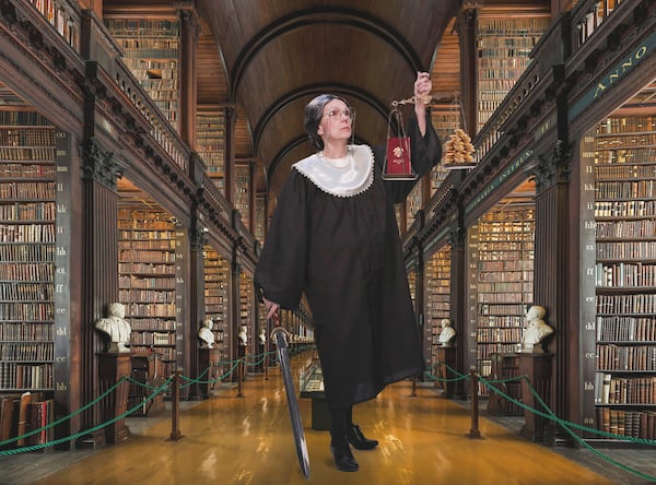There is no proof Justice Ruth Bader Ginsburg carried a sword in the long hall of Dublin's Trinity College, but there's no proof she didn't. Cancer patient Karen Strelecki's costumes made staff and patients smile at her treatment center. (Courtesy of John Gregory Strelecki)