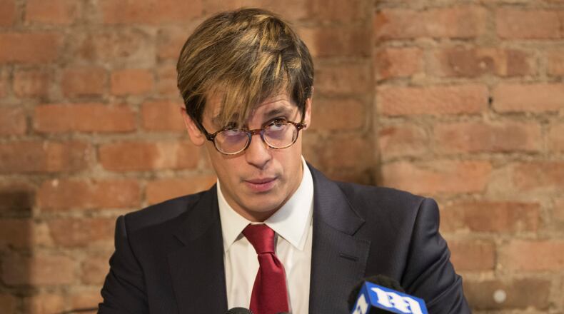 Milo Yiannopoulos speaks during a news conference, Tuesday, Feb. 21, 2017, in New York. Yiannopoulos has resigned as editor of Breitbart Tech after coming under fire from other conservatives over comments on sexual relationships between boys and older men. (AP Photo/Mary Altaffer)