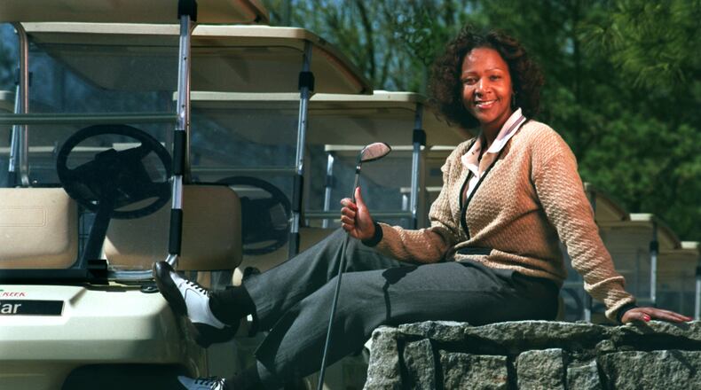In this file photo from 2000, Regina Curry, then the special events coordinator at the Sugar Creek Golf and Tennis Club, poses for a portrait.
