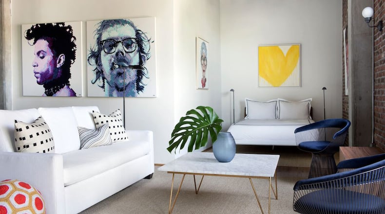 In this modern gallery-like loft in Buckhead Village Lofts, Helen Davis wanted the artwork by Atlanta’s Charlie Hanavich to be the star. Contributed by Sarah Dorio