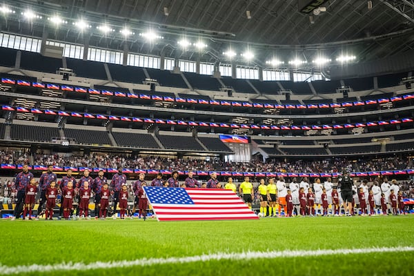 United States , left, and Haiti players line up for opening ceremonies before a CONCACAF Gold Cup soccer match Sunday, June 22, 2025, in Arlington, Texas. (AP Photo/Jessica Tobias)