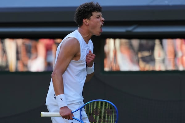 Ben Shelton of the U.S. celebrates winning the men's singles fourth round match against Lorenzo Sonego of Italy at the Wimbledon Tennis Championships in London, Monday, July 7, 2025.(AP Photo/Kirsty Wigglesworth)