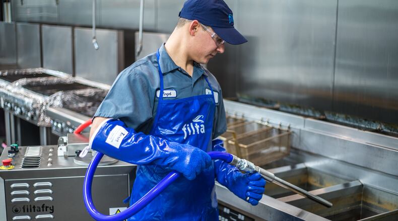 Worker for Athens-based Filta Environmental Kitchen Solutions, which filters and deep-cleans fryers in commercial kitchens,