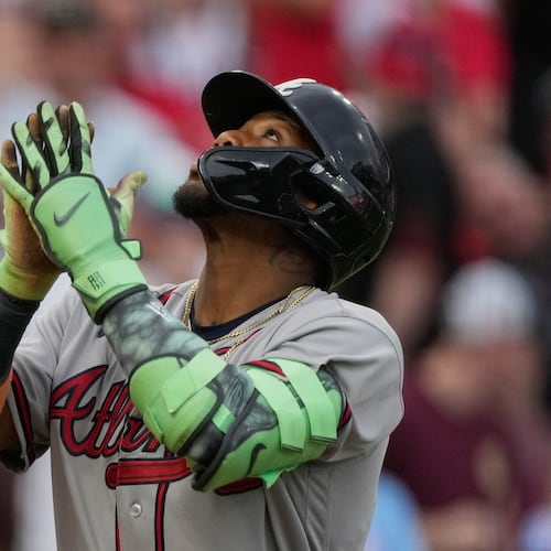 Atlanta Braves right fielder Ronald Acuña Jr. reacts as he crosses home plate after hitting a solo home run during the third inning of a baseball game against the Cincinnati Reds in Cincinnati, Saturday, May 30, 2026. (AP Photo/Carolyn Kaster)