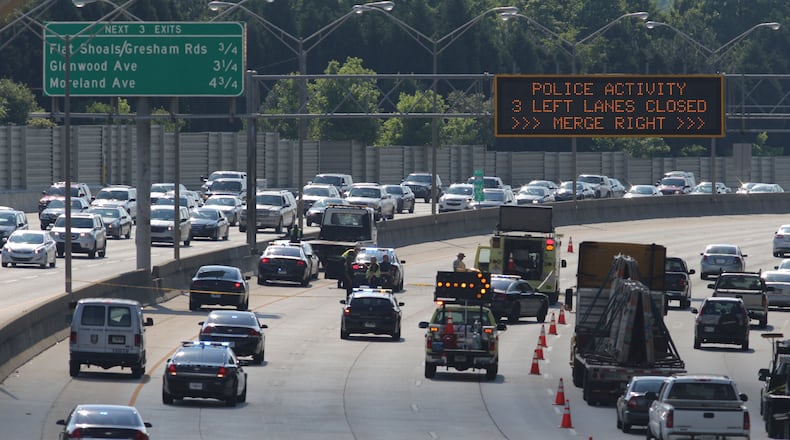 Traffic was tied up after a man shot himself on I-20 in DeKalb County on Thursday afternoon. (Ben Gray / bgray@ajc.com)