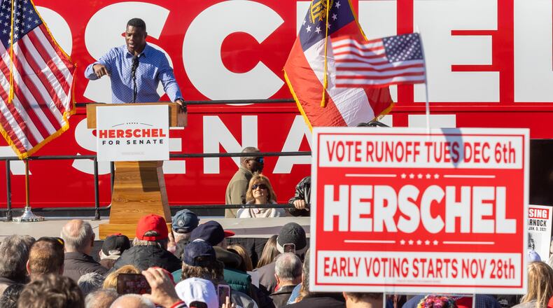 U.S. Senate hopeful Herschel Walker talks to the crowd during a Smyrna rally with Gov. Brian Kemp Saturday, November 19, 2022. (Steve Schaefer/steve.schaefer@ajc.com)