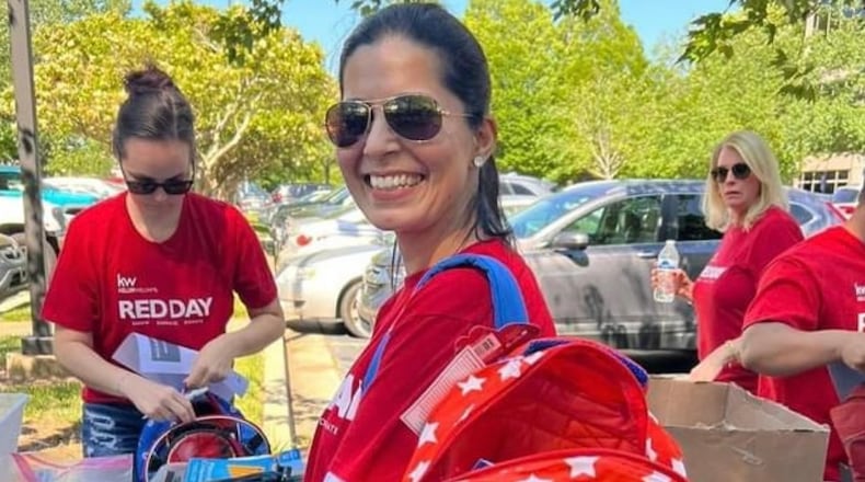 Celebrated every May since 2009, Keller Williams associates from around the world give back to their local communities on RED Day. Over 500 agents in the North Atlanta office put together hundreds of backpacks. Pictured is one of Christi Key's team members Loveleen Guglani sporting a Wonder Woman backpack filled with supplies for a middle schooler.