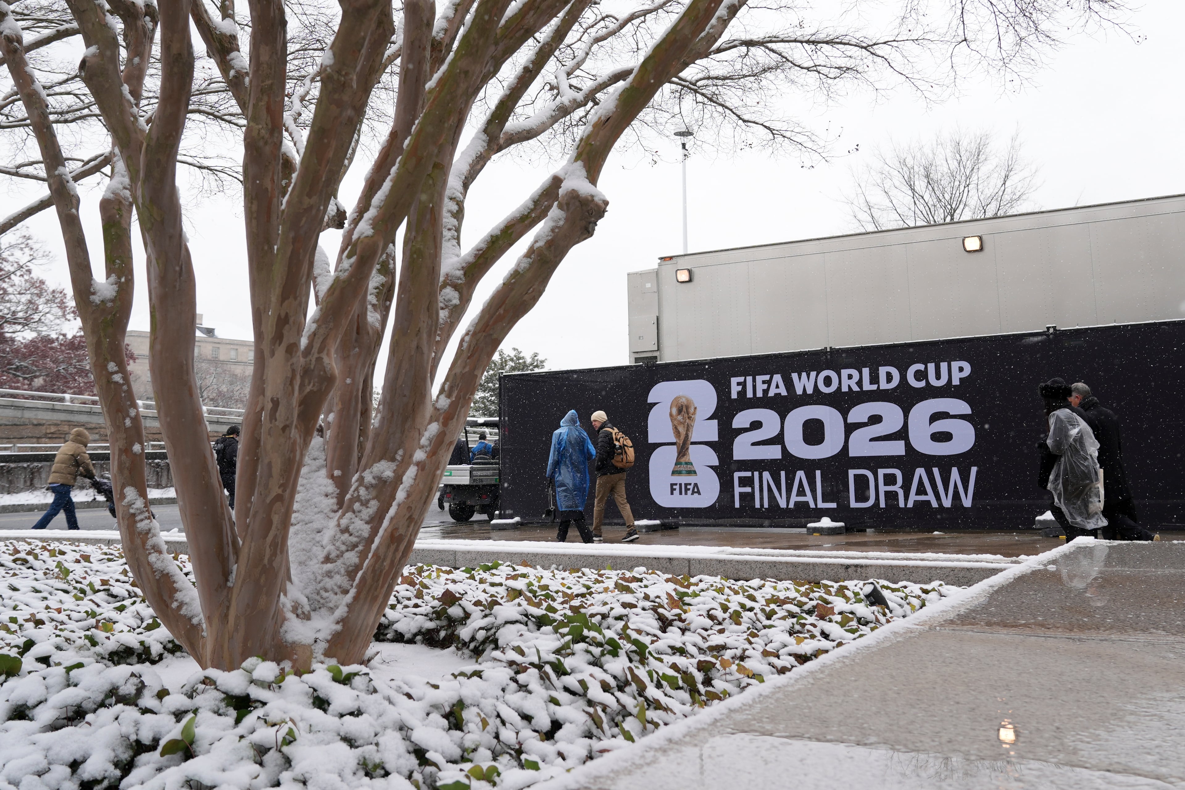 People arrive for the draw for the 2026 soccer World Cup at the Kennedy Center in Washington, Friday, Dec. 5, 2025. (AP Photo/Stephanie Scarbrough)