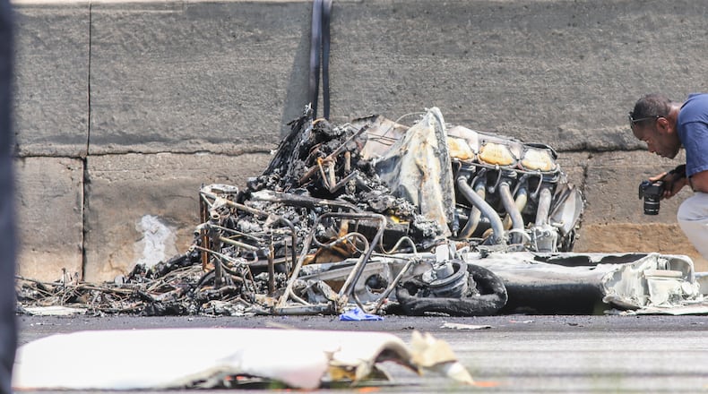 May 8, 2015, DeKalb County: Four people died aboard a small plane after it crashed Friday morning on I-285 at Peachtree Industrial Boulevard. Traffic was shut down in both directions. Three men and one woman were killed in the crash. JOHN SPINK / JSPINK@AJC.COM