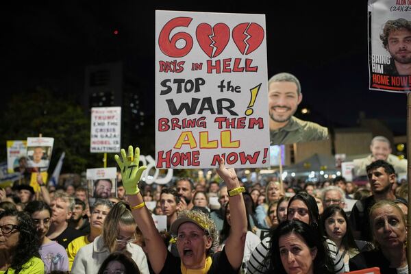 People attend a rally marking 600 days since Israelis were taken hostage by Hamas in Gaza, demanding their release and an end to the war, at a plaza known as the hostages square in Tel Aviv, Israel, Wednesday, May 28, 2025. (AP Photo/Leo Correa)