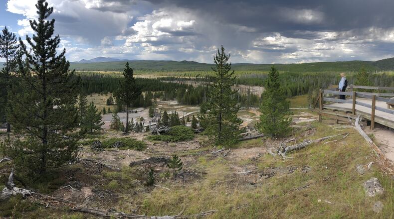 “On a summer afternoon in Yellowstone National Park, we were enjoying the scene at Artists’ Paintpots when these dark clouds began forming overhead,” wrote Guy Ishimoto.