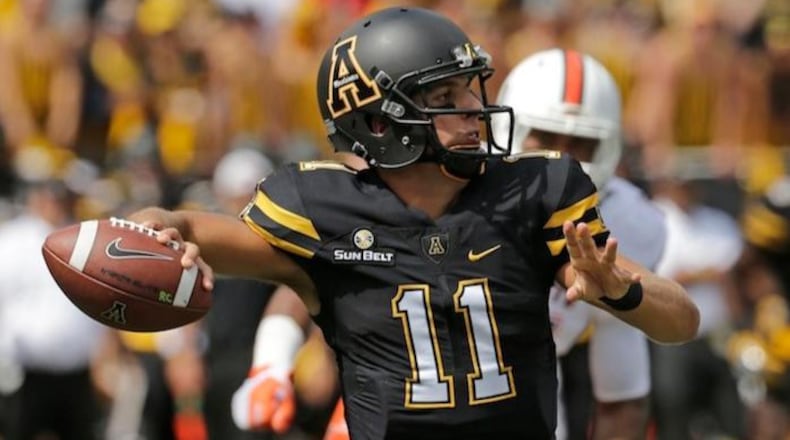 FILE - In this Sept. 17, 2016, file photo, Appalachian State's Taylor Lamb (11) looks to pass against Miami during the first half of an NCAA college football game, in Boone, N.C.  (AP Photo/Chuck Burton, File)