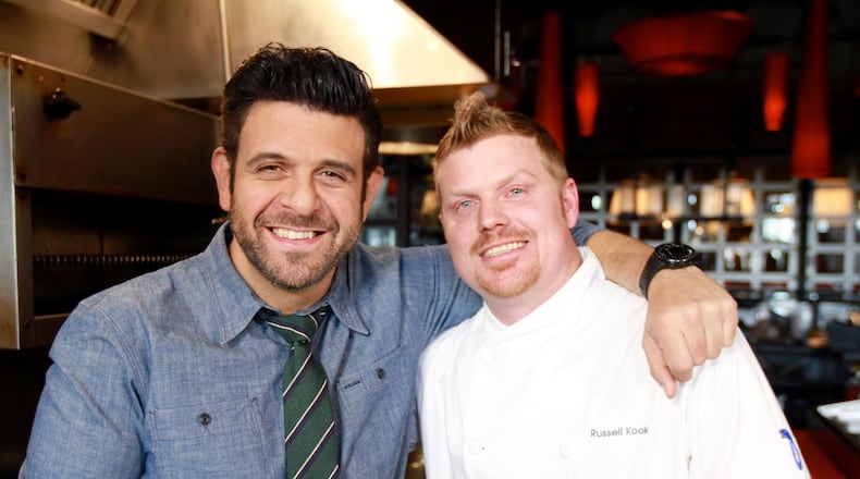 Adam Richman at TWO Urban Licks with then sous chef Russell Kook. (This was taped in January, 2014.) CREDIT: Travel Channel