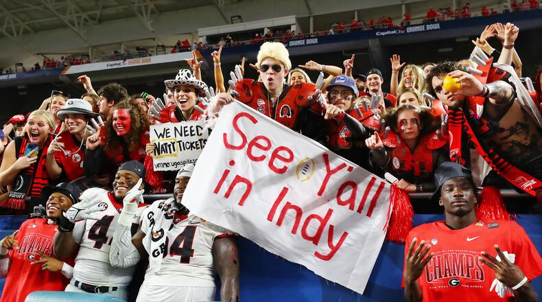 12/31/21 - Miami Gardens - Georgia players join their fans to celebrate beating Michigan 34-11 to win the Orange Bowl at Hard Rock Stadium in Miami Gardens. Curtis Compton / Curtis.Compton@ajc.com