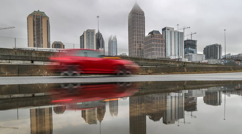 If you have to drive in heavy rain, slow down and allow yourself extra time, Atlanta police agencies suggest. Hazard lights aren't necessary unless in an emergency.