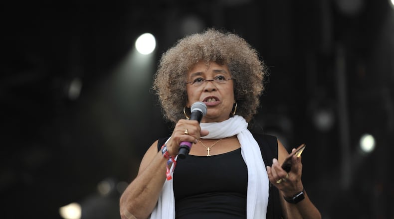 Angela Davis speaks at the Many Rivers to Cross Music and Arts Festival in Fairburn on Oct. 1, 2016. Social justice was one of the festival’s themes. DAVID BARNES / SPECIAL TO AJC