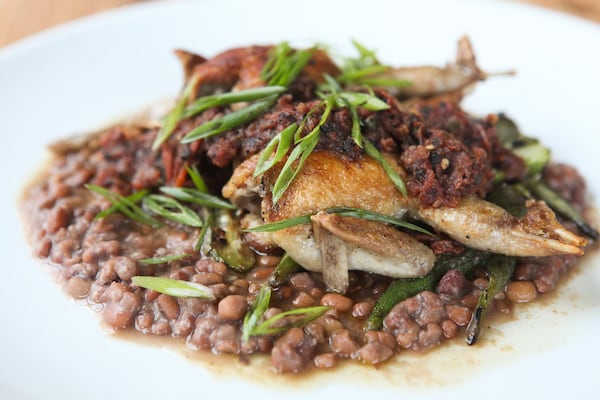 Quail with rancho gordo, and salsa molcajete at 8ARM. / Photo by Renee Brock/Special