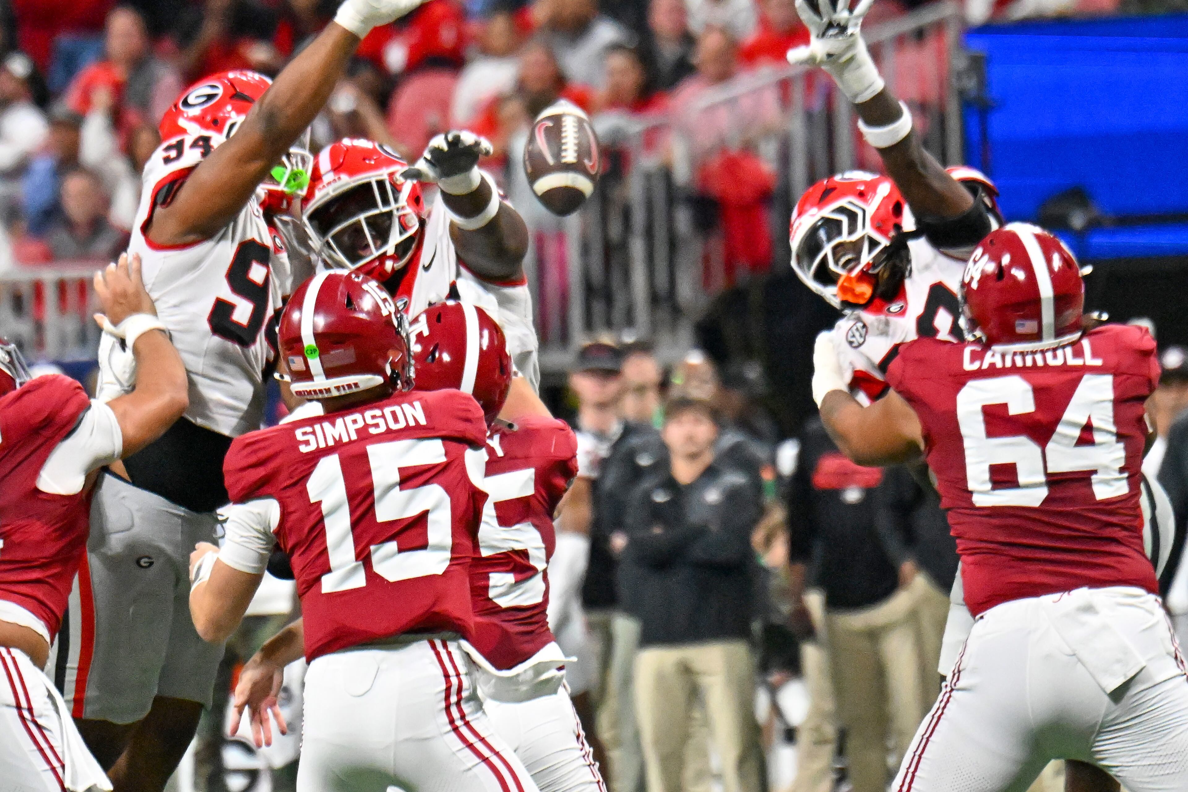 Alabama quarterback Ty Simpson's pass (15) is blocked by the Georgia defense during the first half of the SEC Championship game at Mercedes-Benz Stadium, Saturday, Dec. 6, 2025, in Atlanta. (Hyosub Shin / AJC)