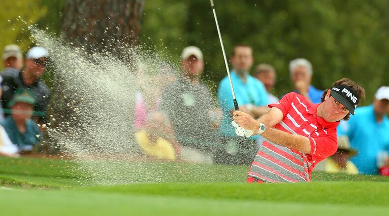 Bubba Watson hits from the bunker on No. 1 during the opening round.