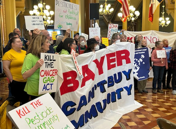 FILE - Protesters congregate at the Iowa state capitol building in Des Moines on Feb. 10, 2025, to rally against a bill that would protect pesticide companies from lawsuits that claim its popular weedkiller causes cancer. (AP Photo/Hannah Fingerhut, File)