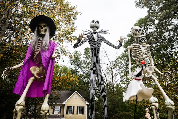 Home Depot decorations — Jack Skellington flanked by two Skelly skeletons — stand tall on the Ridleys' lawn in Cumming, on Thursday, Sept. 25, 2025. (Abbey Cutrer/AJC) 