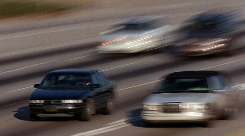 Cars speed along I-20 on a Saturday afternoon. (BRANT SANDERLIN/AJC file)