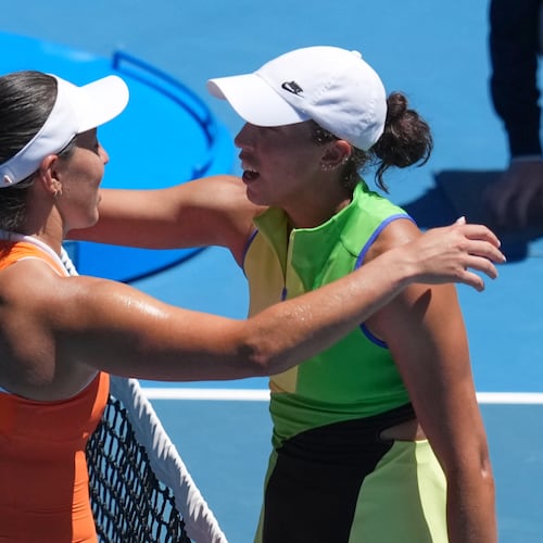 Jessica Pegula, left, of the U.S., is congratulated by her compatriot Madison Keys after winning their fourth round match at the Australian Open tennis championship in Melbourne, Australia, Monday, Jan. 26, 2026. (AP Photo/Asanka Brendon Ratnayake)