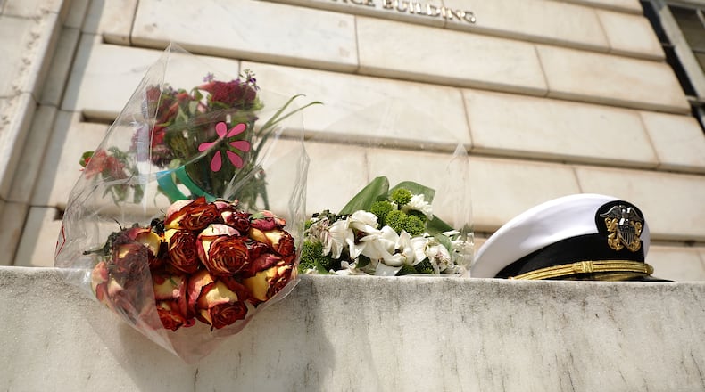 An impromptu memorial of flowers and a U.S. Navy officer’s hat outside of the Russell Senate Office Building in honor of U.S. Sen. John McCain, R-Ariz. Chip Somodevilla/Getty Images