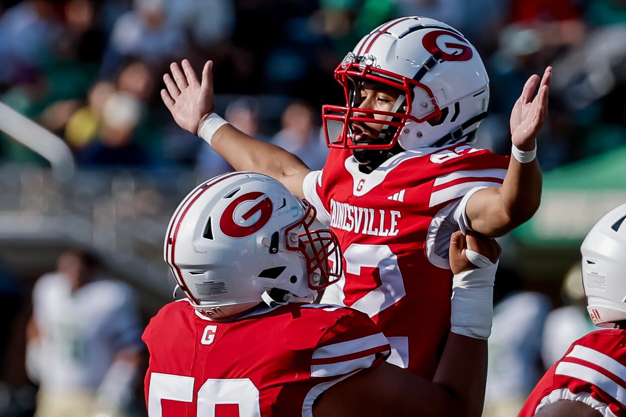 Gainesville kicker Dwayne Carter III (right) celebrates his field goal with Ethan Aguirre during the first half against host Buford on Saturday, Aug. 22, 2026. Carter converted both of his field goal attempts in the 39-19 loss to the Wolves. (Erik S. Lesser for the AJC)